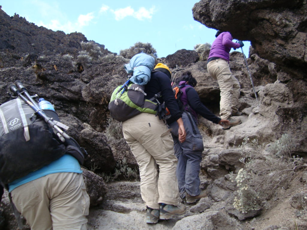 Women hikers climbing up Mount Kilimanjaro